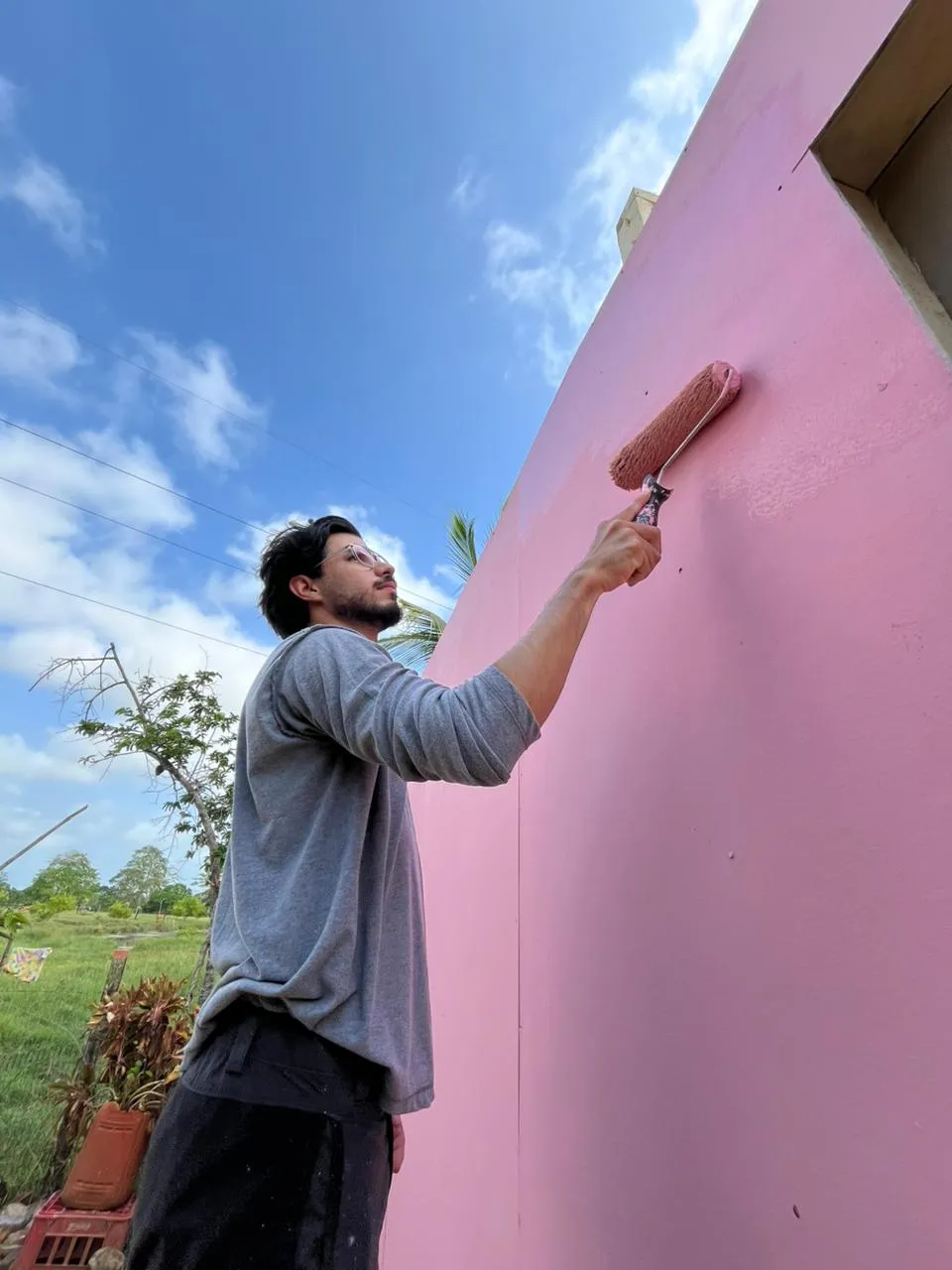 Volunteer painting the house