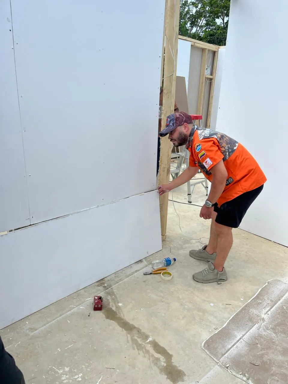 Volunteer cutting wood